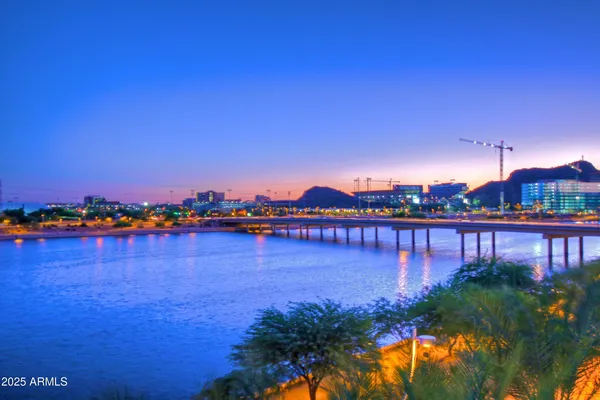 a view of a swimming pool with a table and chairs