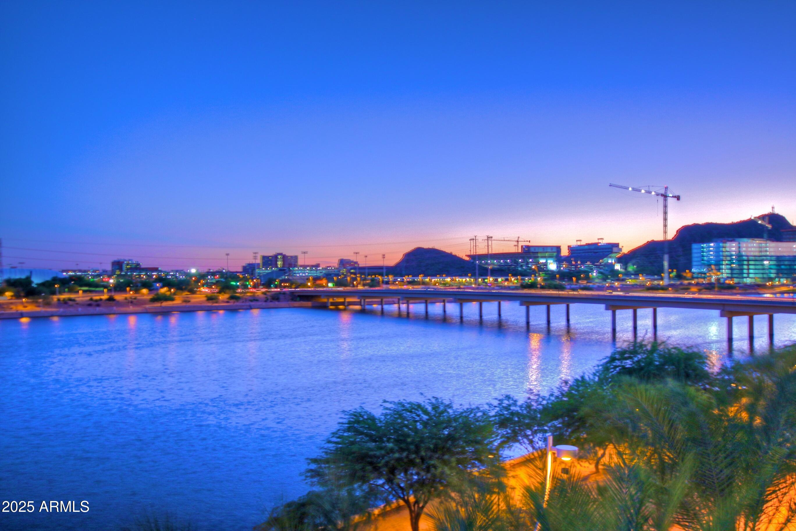 945 East Playa Del Norte Drive, Unit 3013 Tempe, AZ 85288 - Photo 33 of 36 a view of a lake with houses