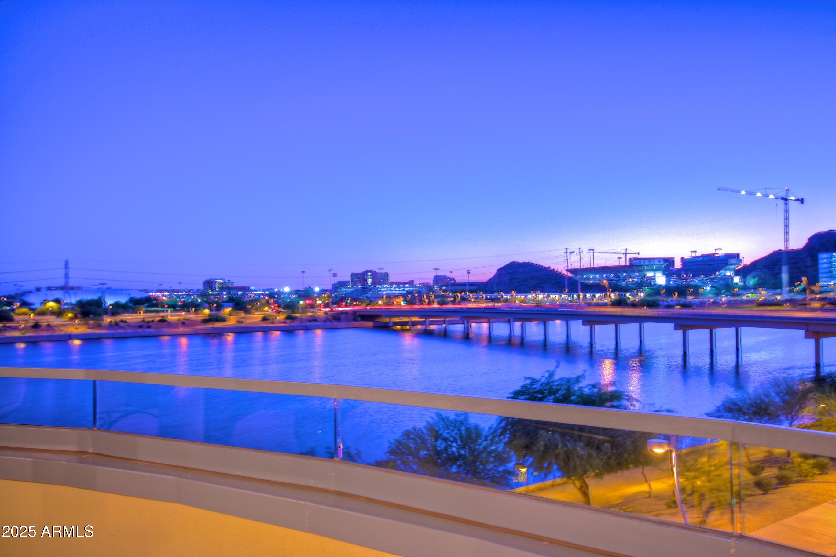 945 East Playa Del Norte Drive, Unit 3013 Tempe, AZ 85288 - Photo 34 of 36 a view of a lake with houses