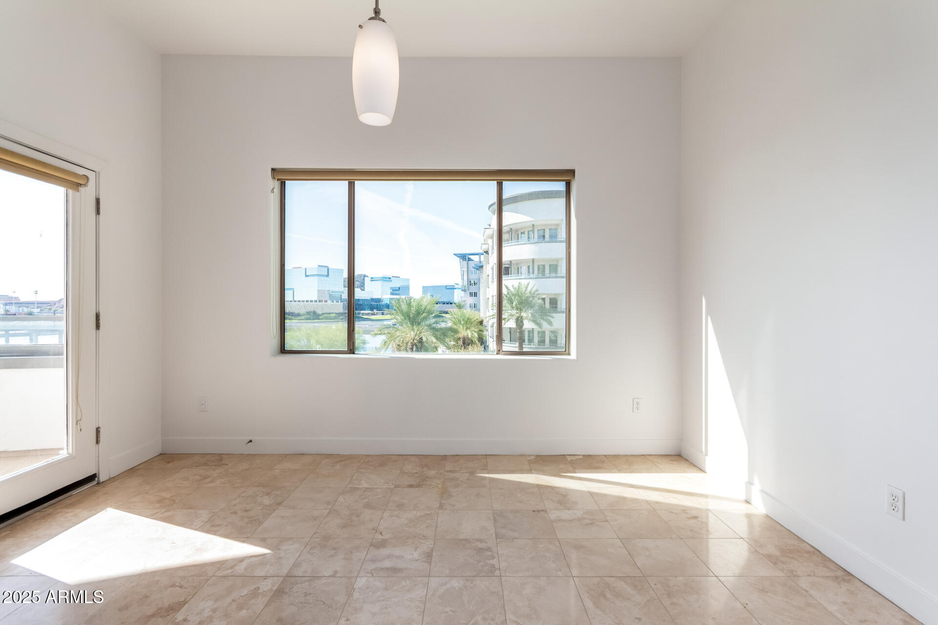 945 East Playa Del Norte Drive, Unit 3013 Tempe, AZ 85288 - Photo 8 of 36 an empty room with windows