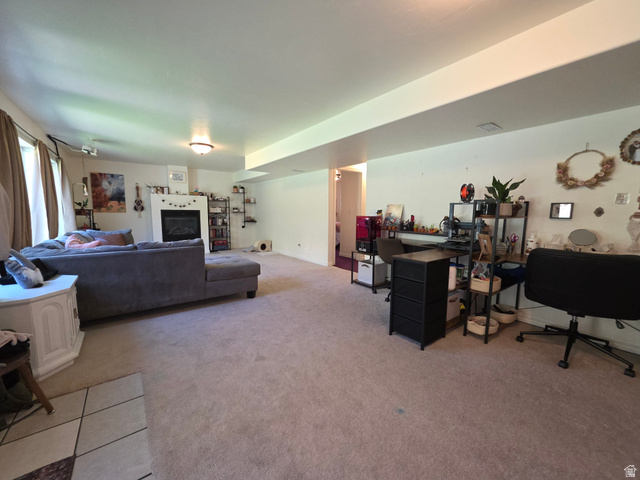 387 North Loafer Canyon Road Payson, UT 84651 - Photo 55 of 94 Spacious living area featuring neutral carpeting, recessed lighting, a fireplace with a white mantle, and a white ceiling
