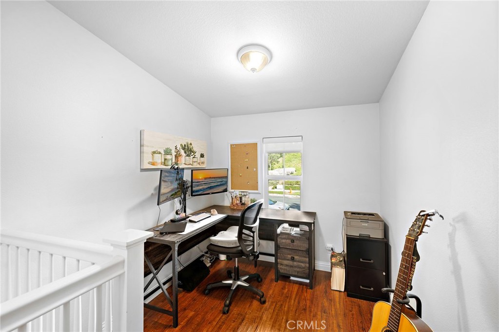 73 Platinum Circle Ladera Ranch, CA 92694 - Photo 14 of 28 a view of a workspace with furniture and wooden floor