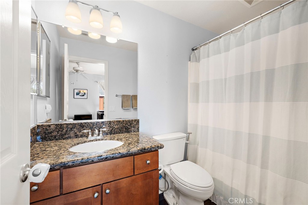 73 Platinum Circle Ladera Ranch, CA 92694 - Photo 15 of 28 a bathroom with a granite countertop sink and a mirror