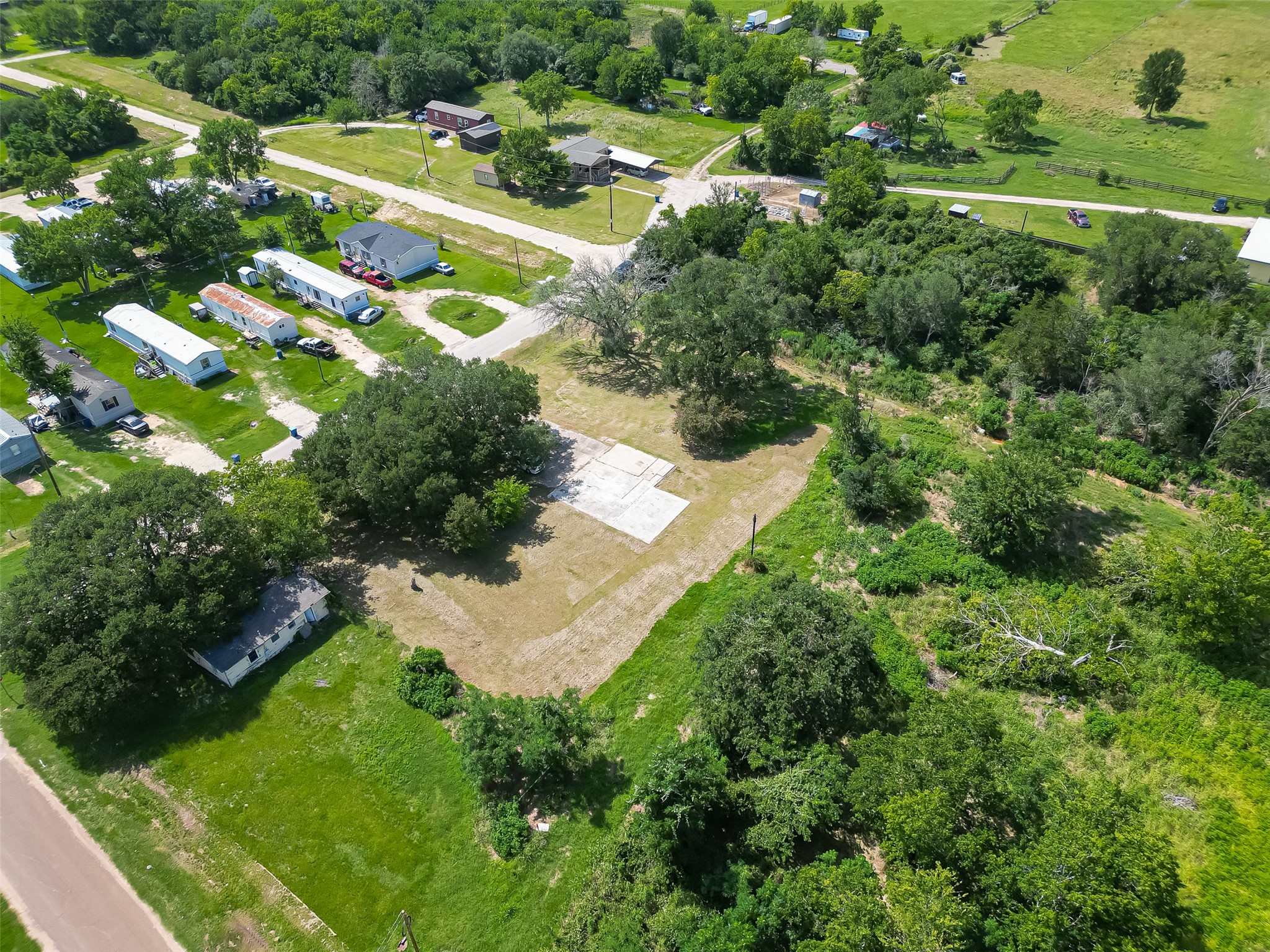 210 5th Street Hempstead, TX 77445 - Photo 23 of 36 a view of a small yard with lots of green space