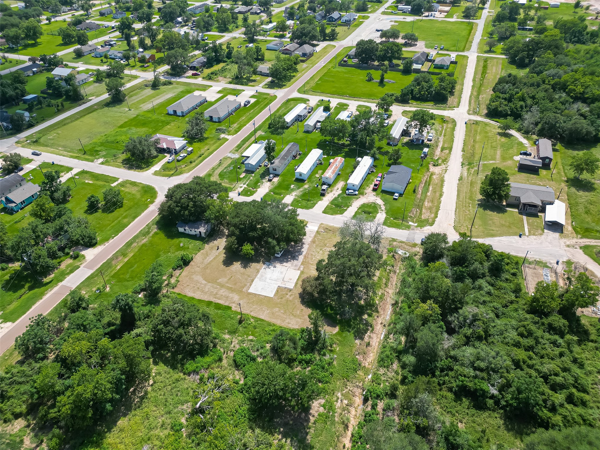 210 5th Street Hempstead, TX 77445 - Photo 26 of 36 an aerial view of residential houses with outdoor space and street view