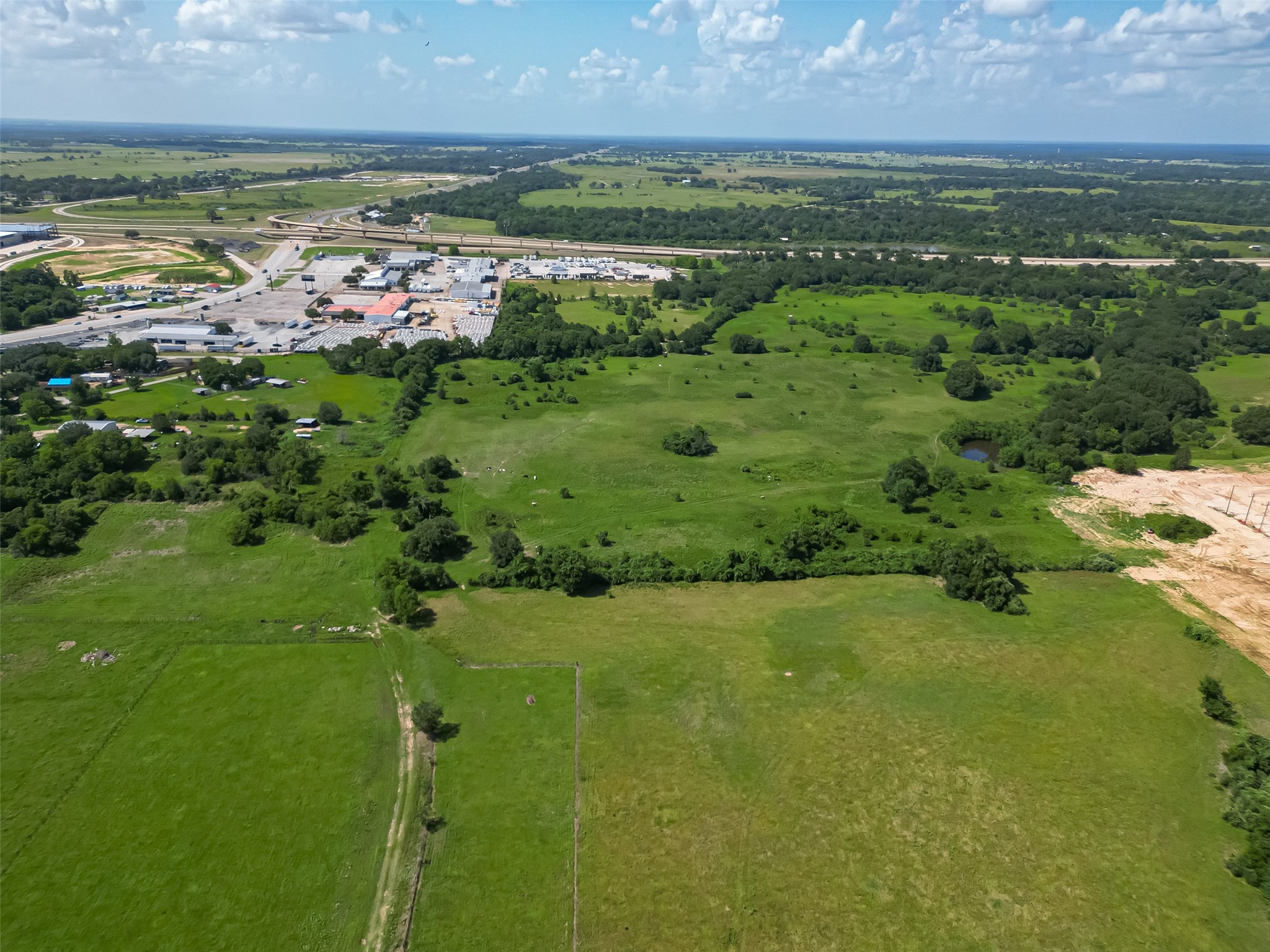 210 5th Street Hempstead, TX 77445 - Photo 34 of 36 a view of a lake with a city
