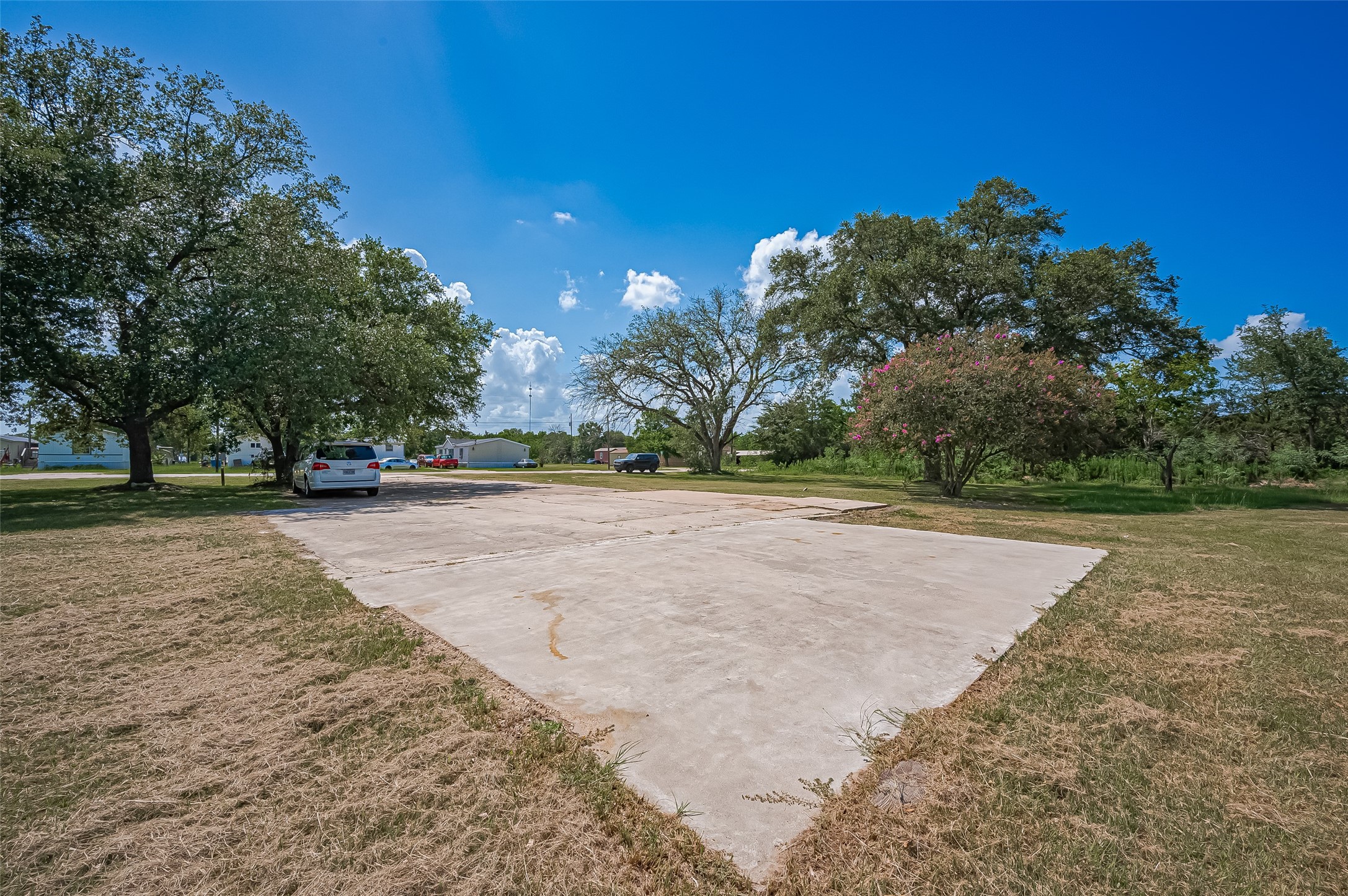 210 5th Street Hempstead, TX 77445 - Photo 7 of 36 a view of outdoor space with trees
