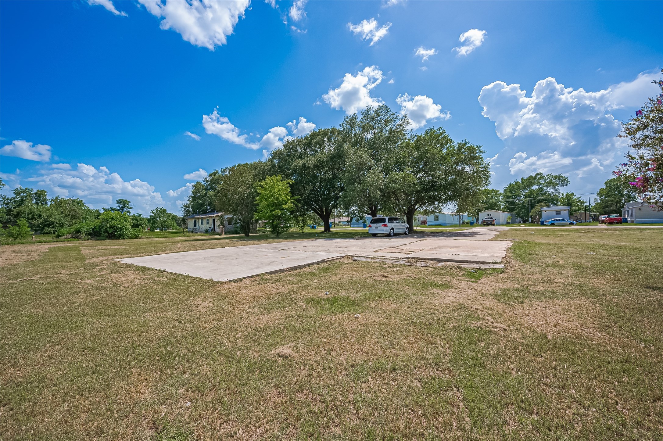 210 5th Street Hempstead, TX 77445 - Photo 9 of 36 a view of a playground with basketball court