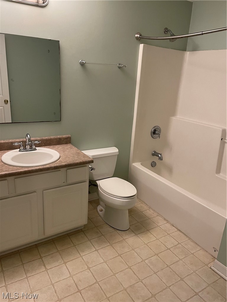 2819 Best Road Cambridge, OH 43725 - Photo 19 of 33 Full bathroom with toilet, vanity, tile flooring, and shower combination