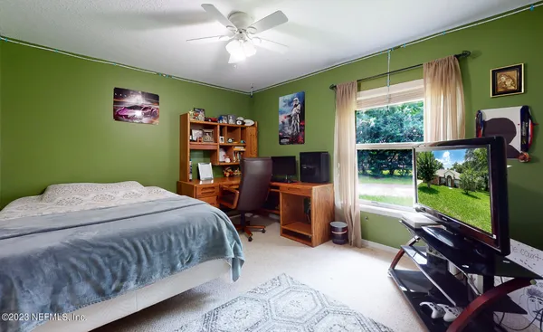 a bedroom with a bed and furniture
