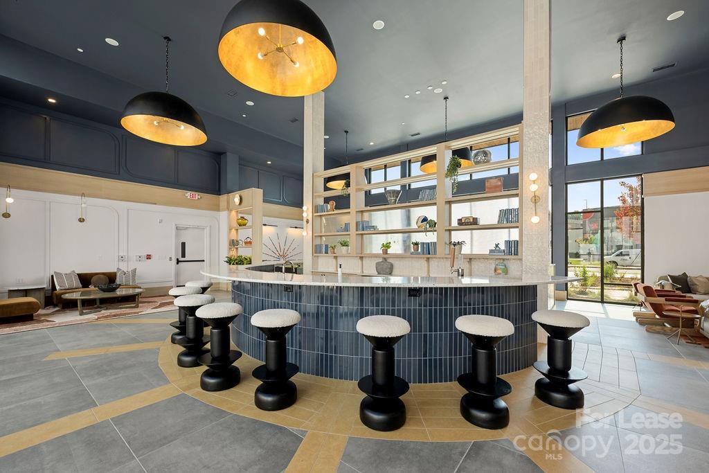 4101 Raleigh Street, Unit B1 Charlotte, NC 28206 - Photo 23 of 48 a kitchen with a sink and a stove