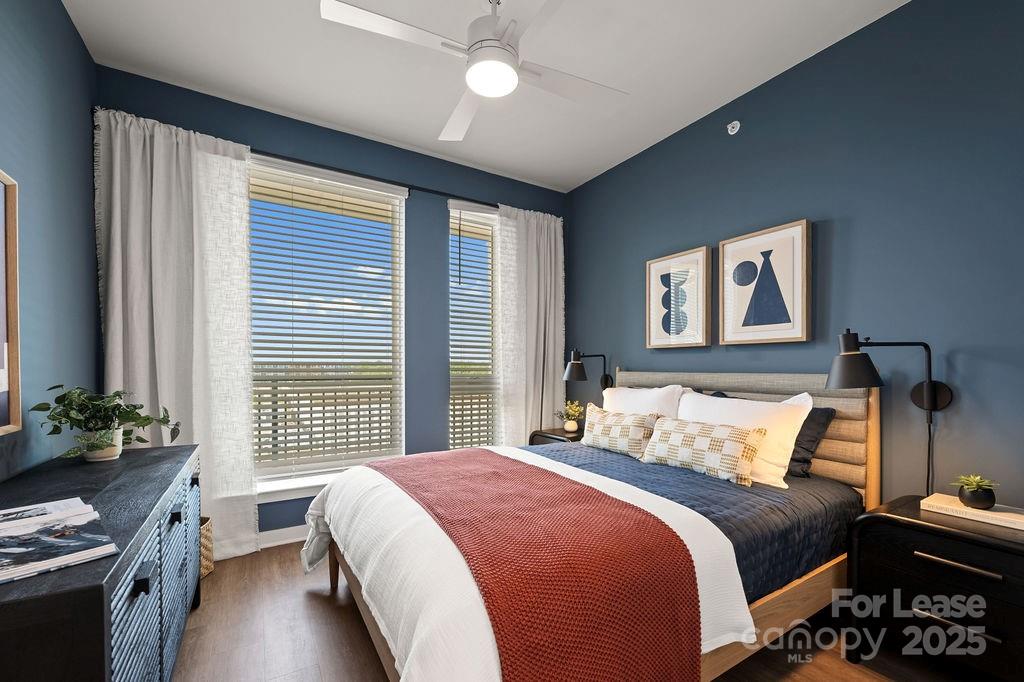 4101 Raleigh Street, Unit B1 Charlotte, NC 28206 - Photo 41 of 48 a bedroom with a bed and a chandelier