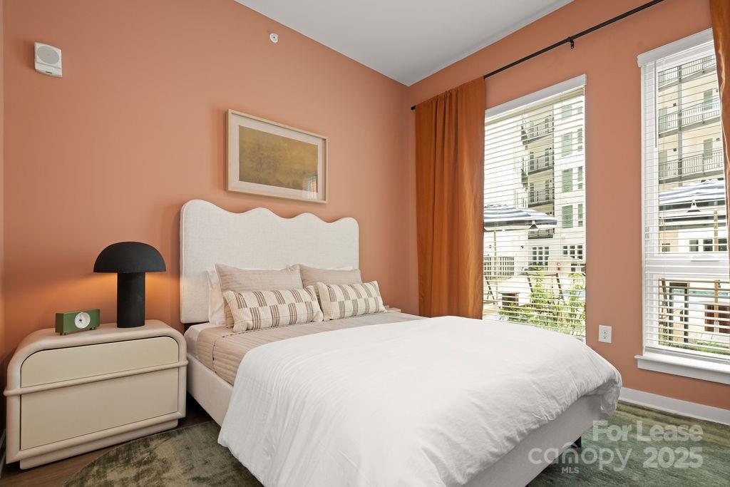 4101 Raleigh Street, Unit B1 Charlotte, NC 28206 - Photo 46 of 48 a bedroom with a bed and a window