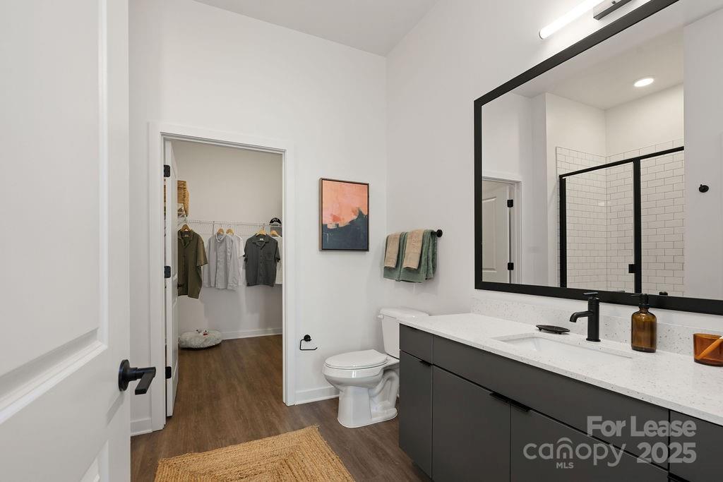 4101 Raleigh Street, Unit B1 Charlotte, NC 28206 - Photo 47 of 48 a bathroom with a sink double vanity and a mirror