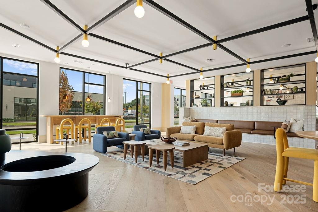 4101 Raleigh Street, Unit B1 Charlotte, NC 28206 - Photo 9 of 48 a living room with furniture and a large window