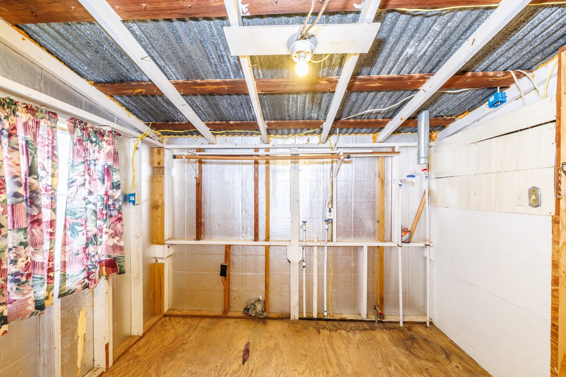 406 Carpenter Street Smiley, TX 78159 - Photo 12 of 17 Unfinished basement featuring wood finished floors