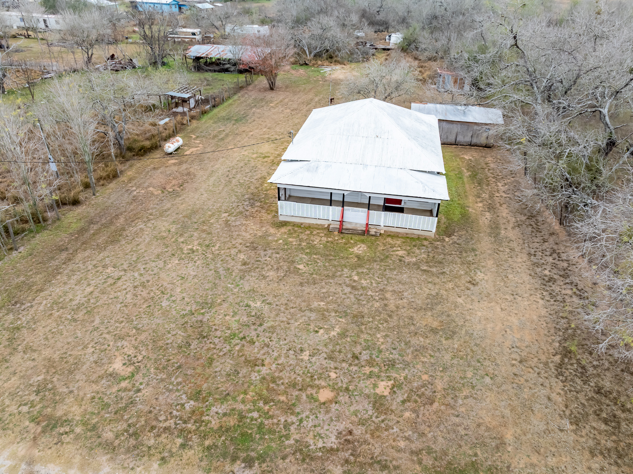 406 Carpenter Street Smiley, TX 78159 - Photo 2 of 17 an aerial view of a house with a yard