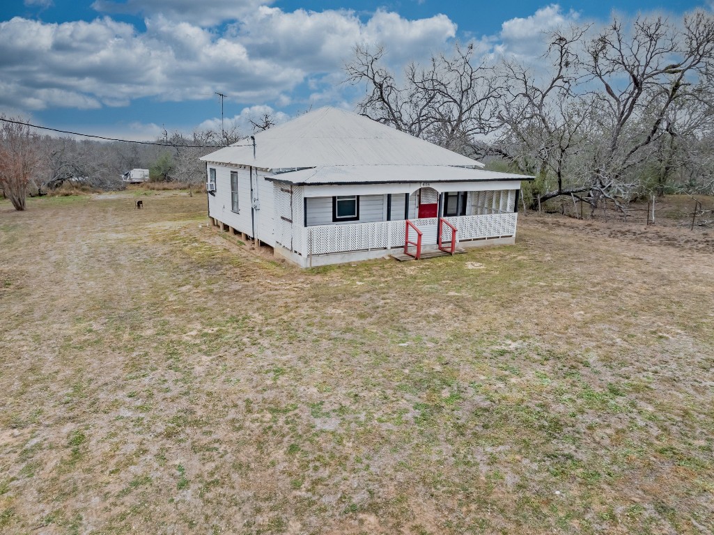 406 Carpenter Street Smiley, TX 78159 - Photo 5 of 17 View of front of house with a front lawn and a metal roof