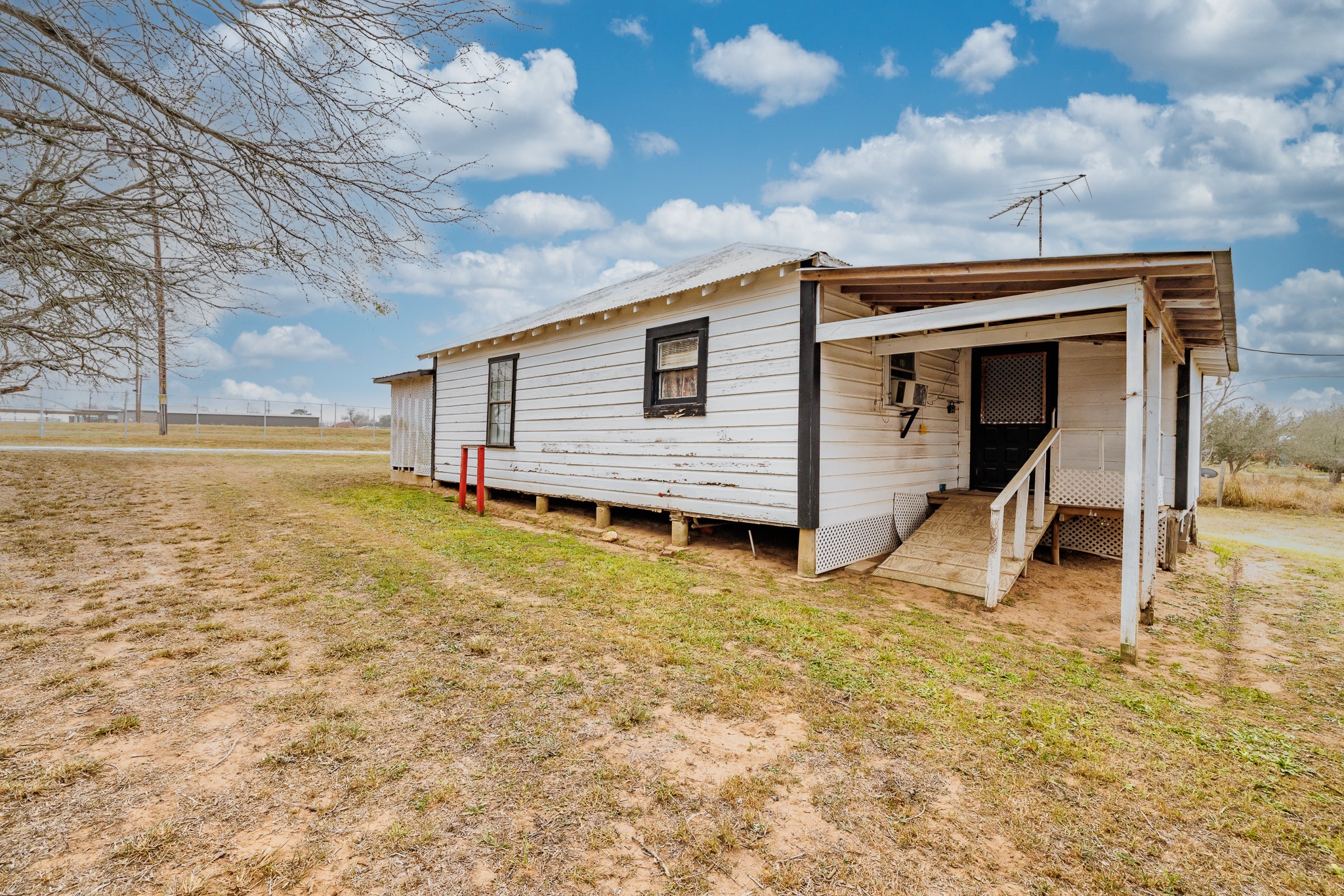406 Carpenter Street Smiley, TX 78159 - Photo 8 of 17 a view of a house with a backyard
