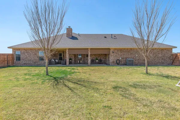 a view of an house with backyard porch and outdoor space