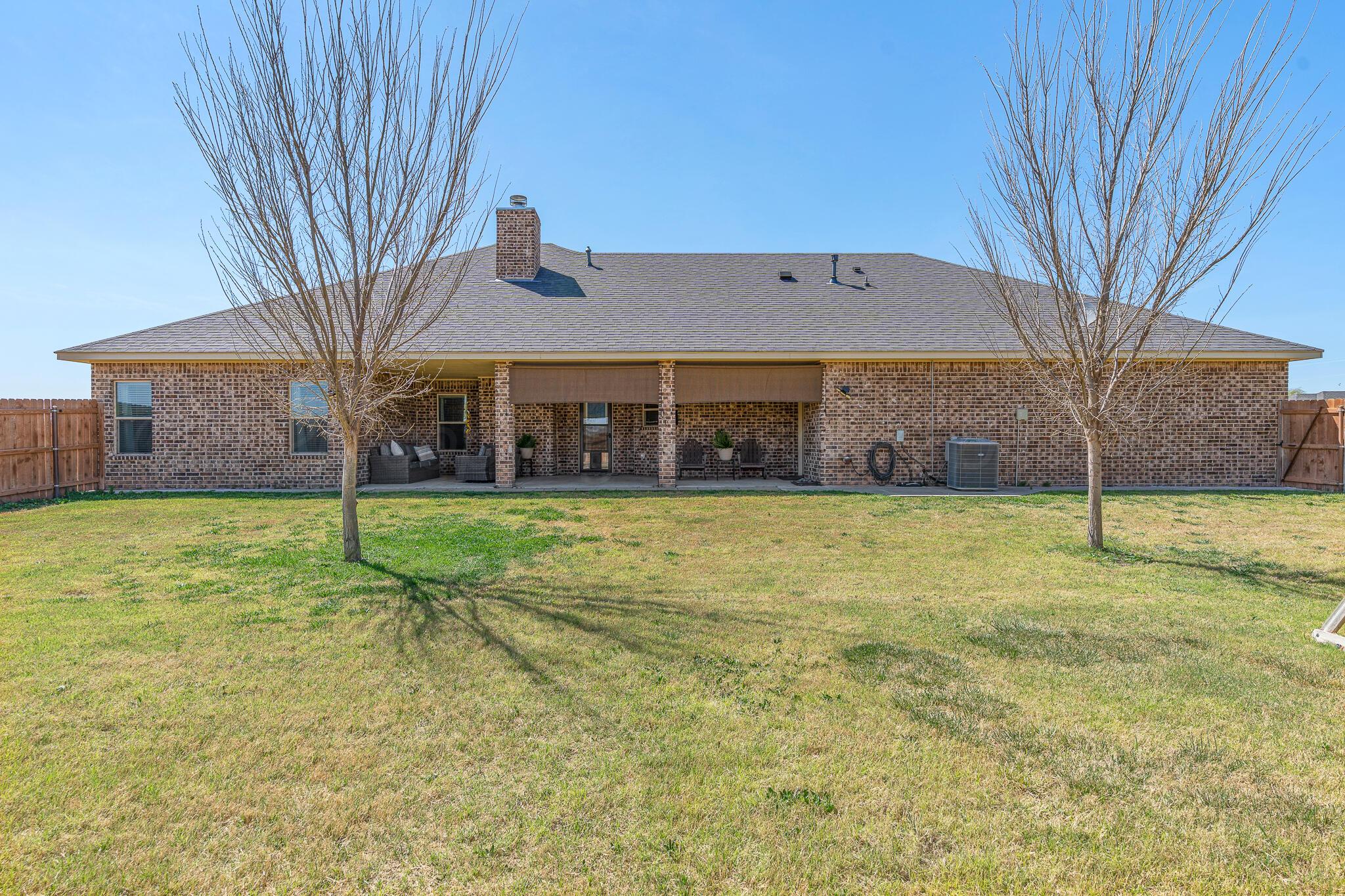 9801 Yesterday Amarillo, TX 79119 - Photo 14 of 54 a view of a house with a yard