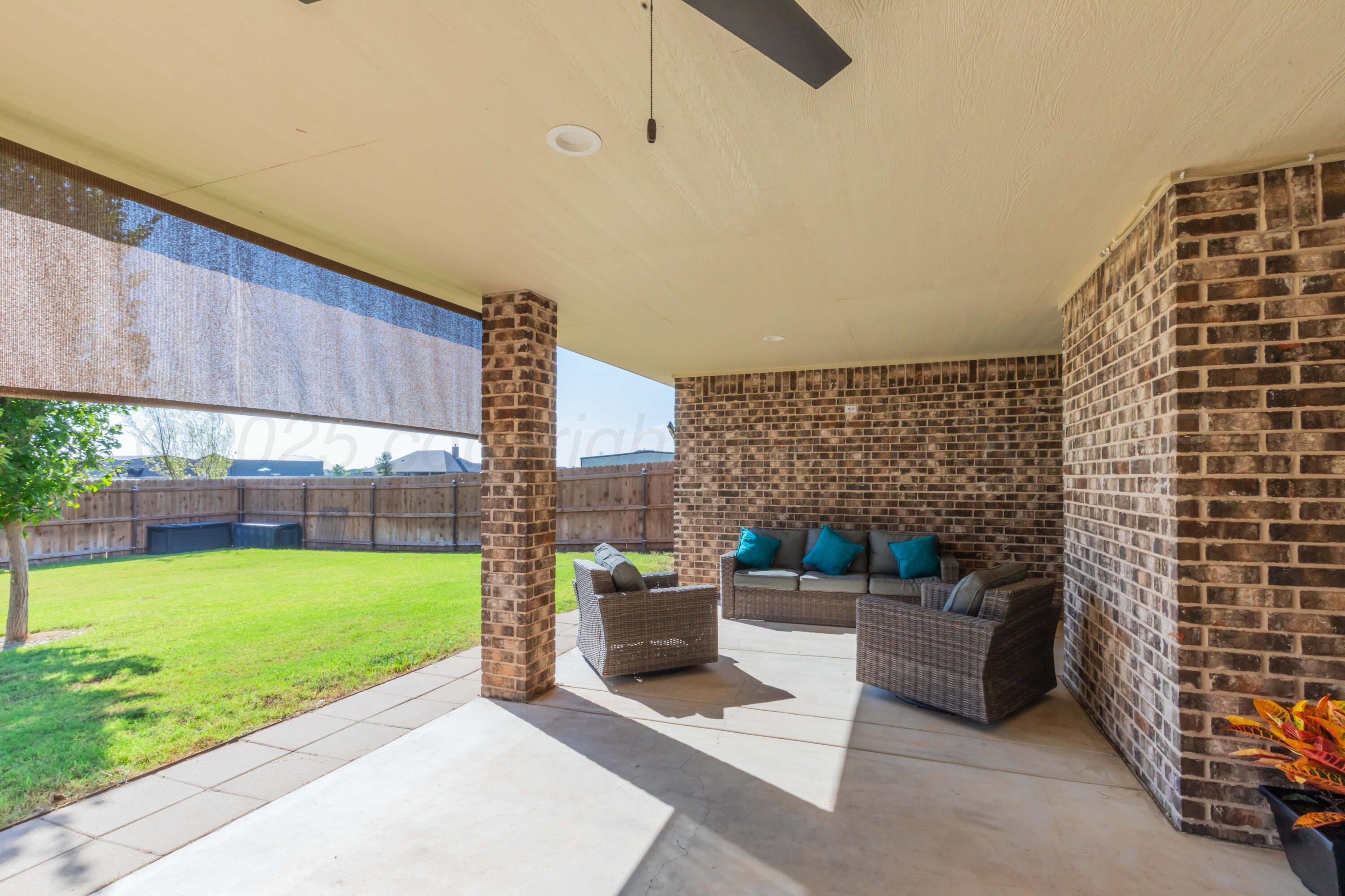 9801 Yesterday Amarillo, TX 79119 - Photo 15 of 54 a view of a patio with a dining table and chairs with plants and plants