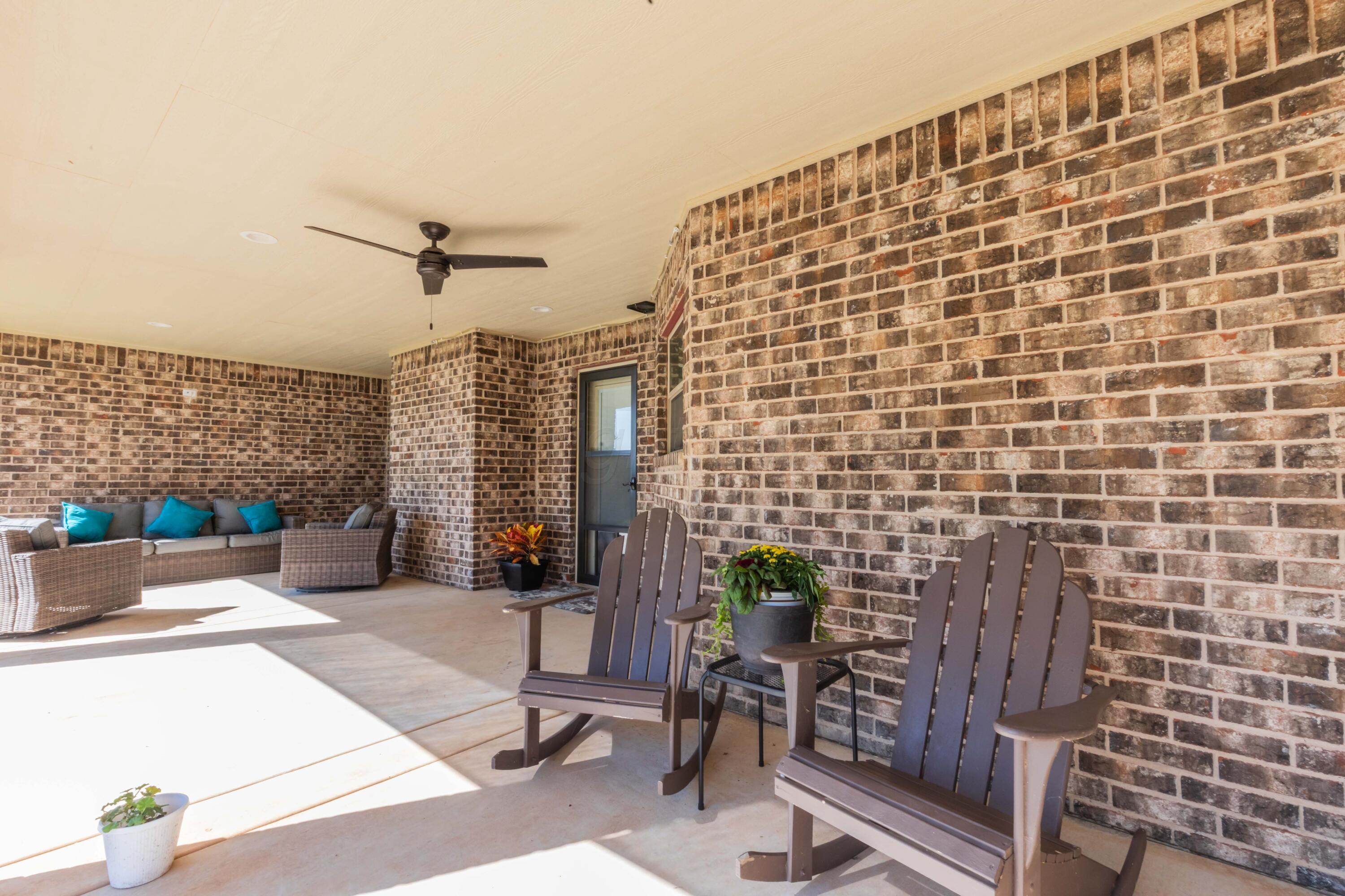 9801 Yesterday Amarillo, TX 79119 - Photo 16 of 54 a patio with table and chairs