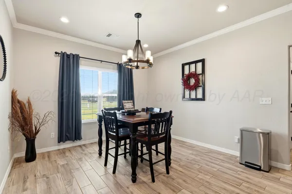 a kitchen with granite countertop a sink a stove and cabinets