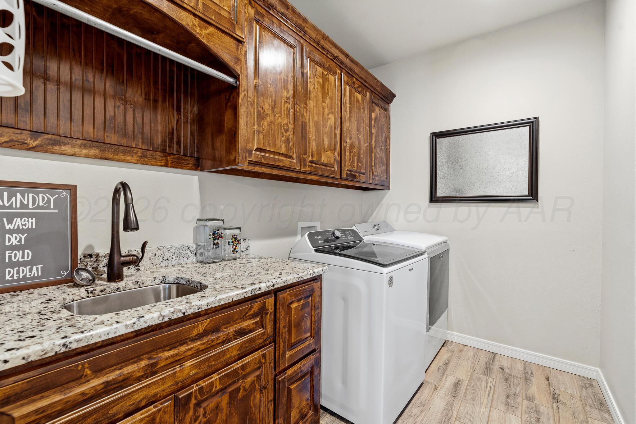 9801 Yesterday Amarillo, TX 79119 - Photo 23 of 54 a kitchen with stainless steel appliances granite countertop a sink stove and cabinets