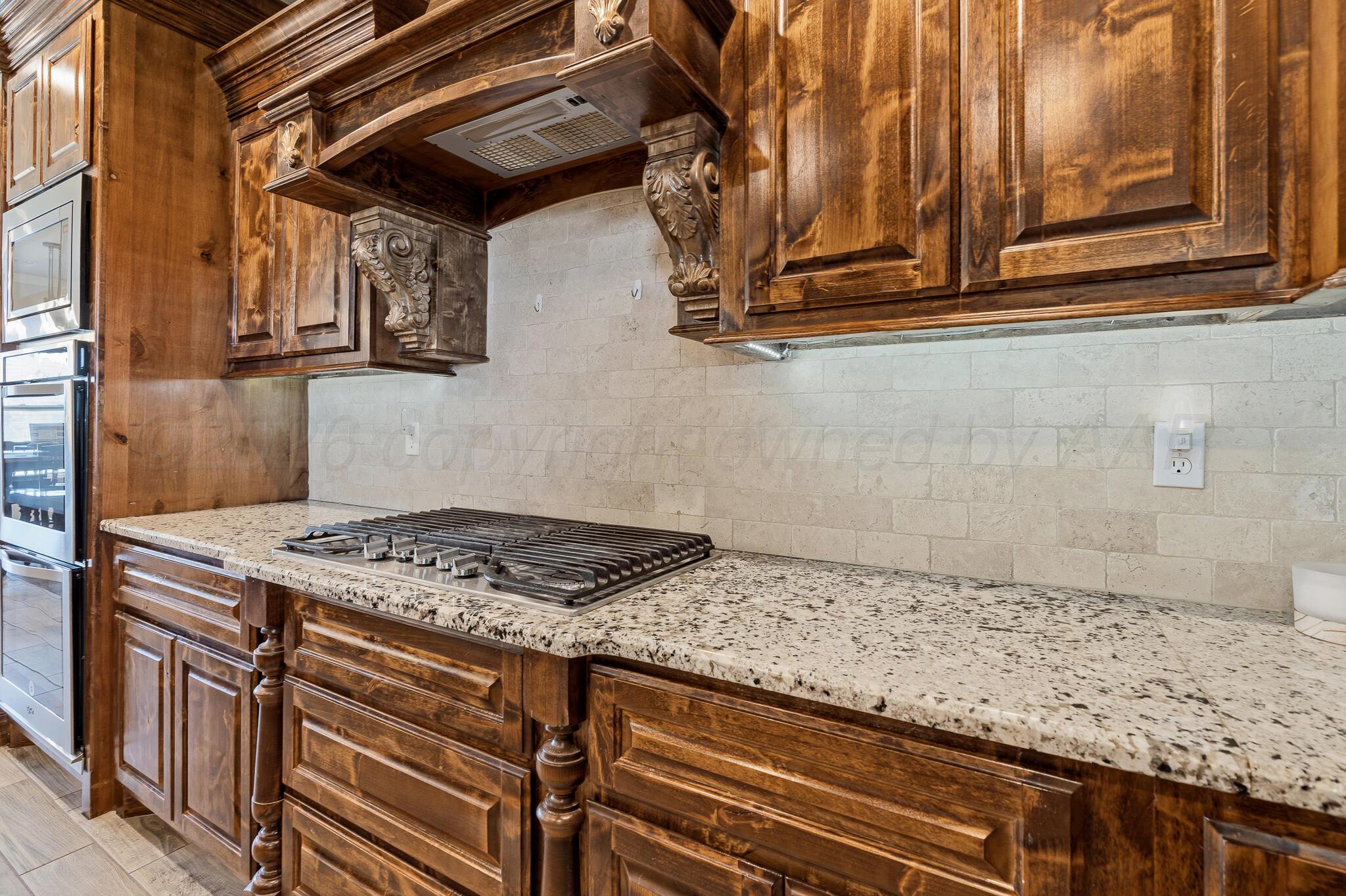 9801 Yesterday Amarillo, TX 79119 - Photo 26 of 54 a stove top oven sitting inside of a kitchen