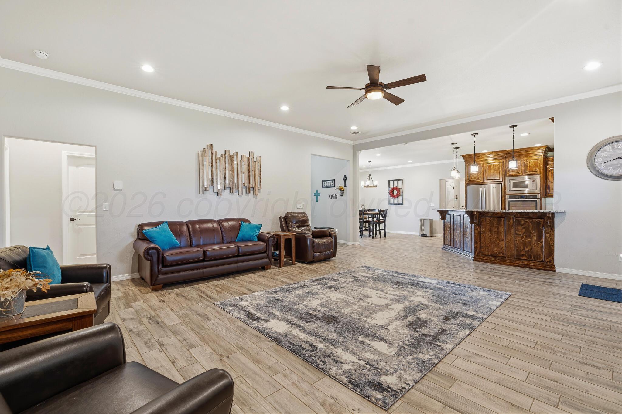 9801 Yesterday Amarillo, TX 79119 - Photo 30 of 54 a living room with furniture and a flat screen tv