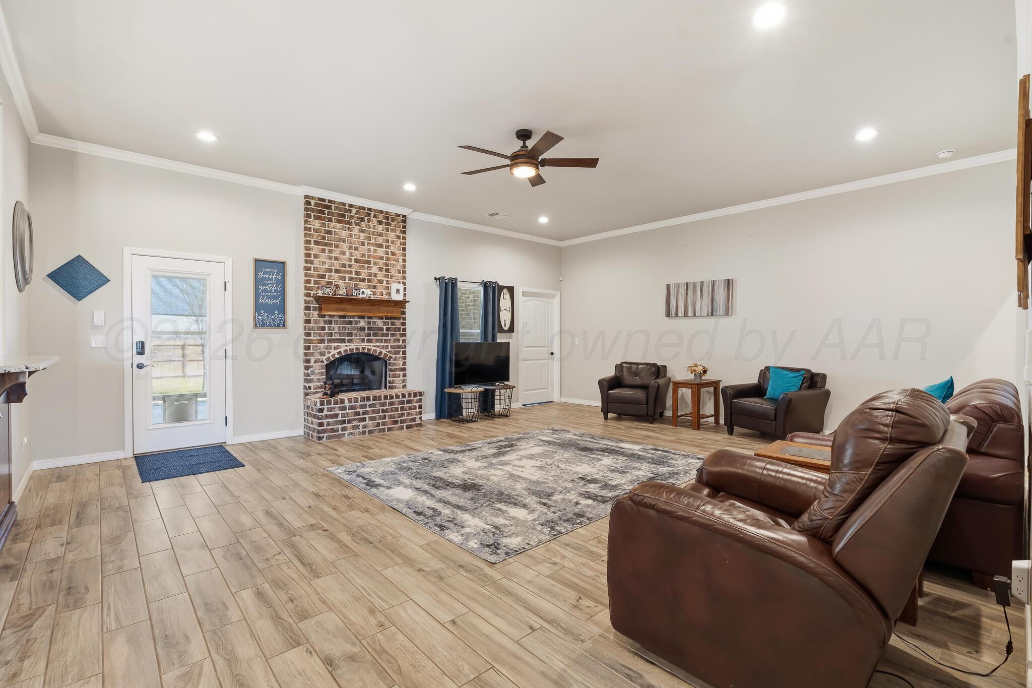 9801 Yesterday Amarillo, TX 79119 - Photo 31 of 54 a living room with furniture and a wooden floor
