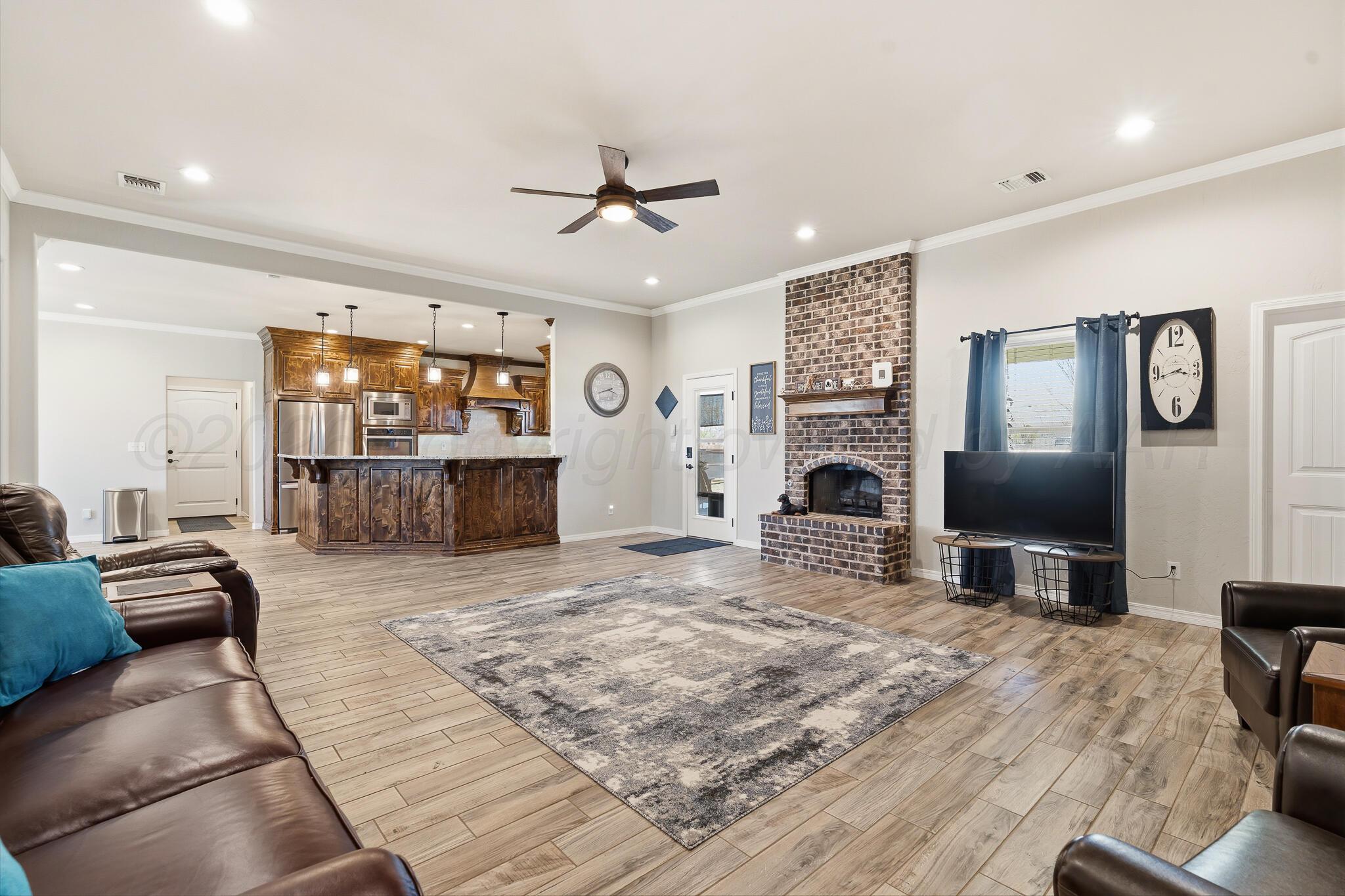 9801 Yesterday Amarillo, TX 79119 - Photo 32 of 54 a view of living room with furniture and flat screen tv