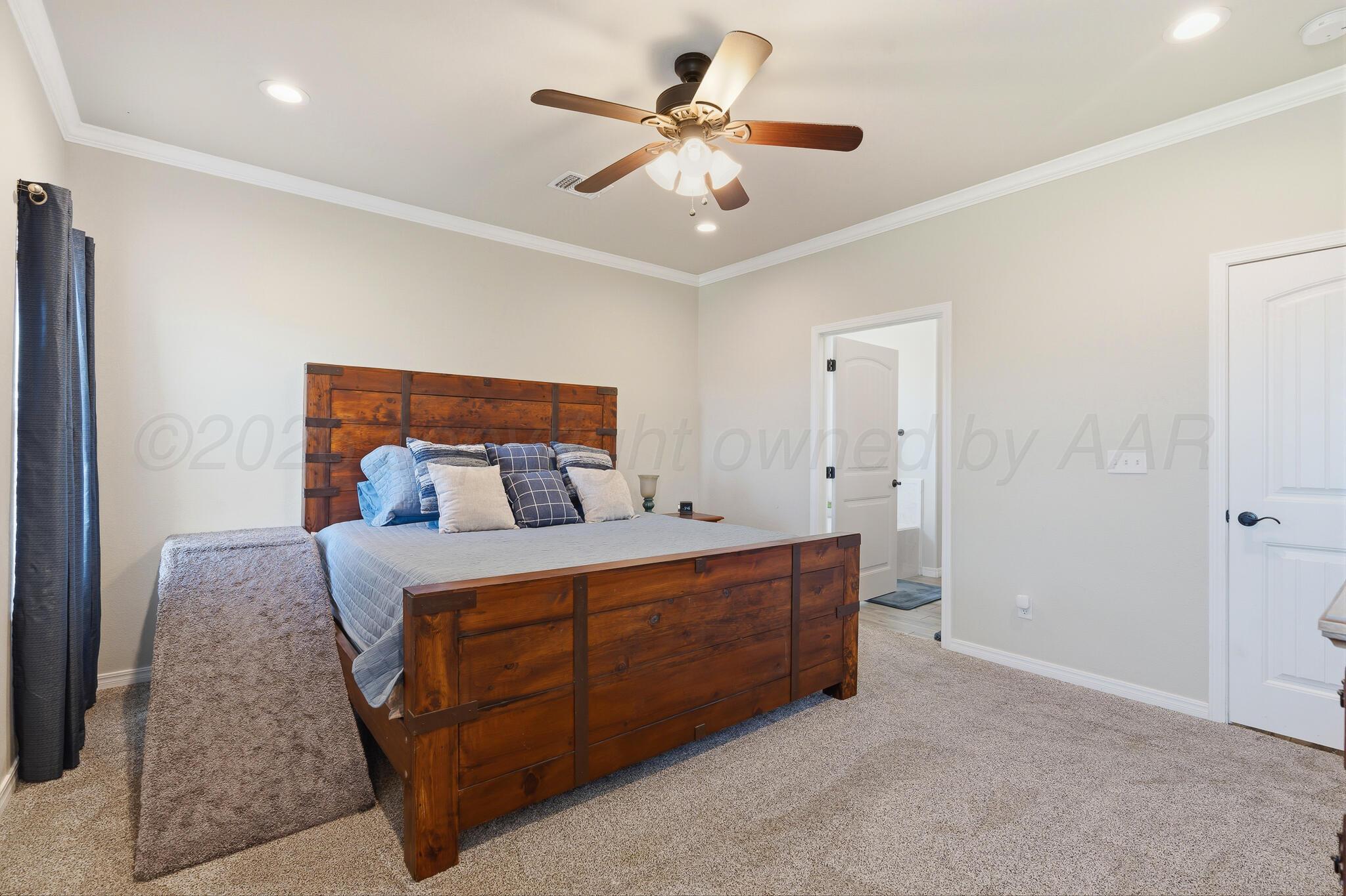 9801 Yesterday Amarillo, TX 79119 - Photo 33 of 54 a bed room with a bed and a ceiling fan