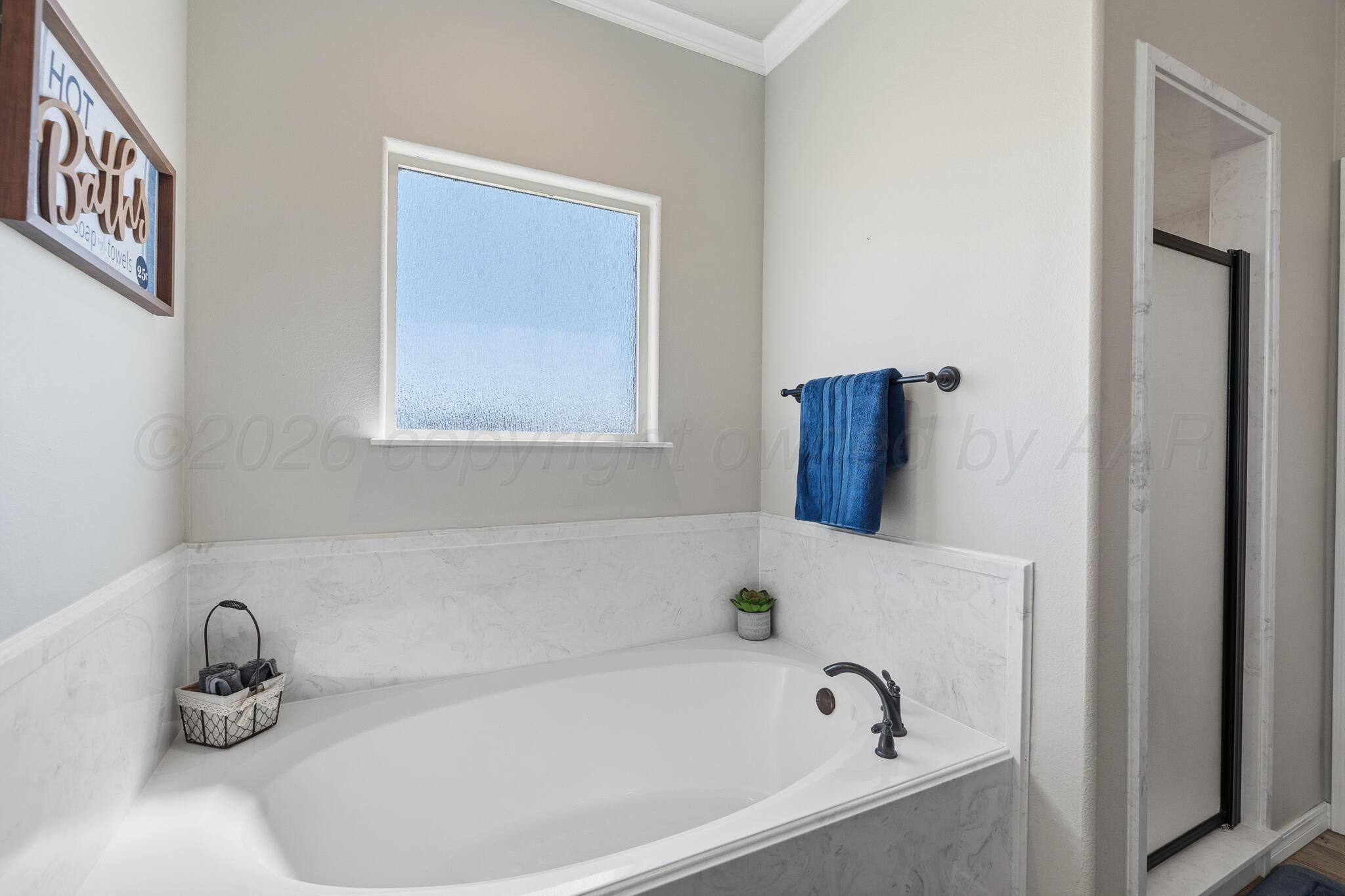 9801 Yesterday Amarillo, TX 79119 - Photo 36 of 54 a bathroom with a bathtub