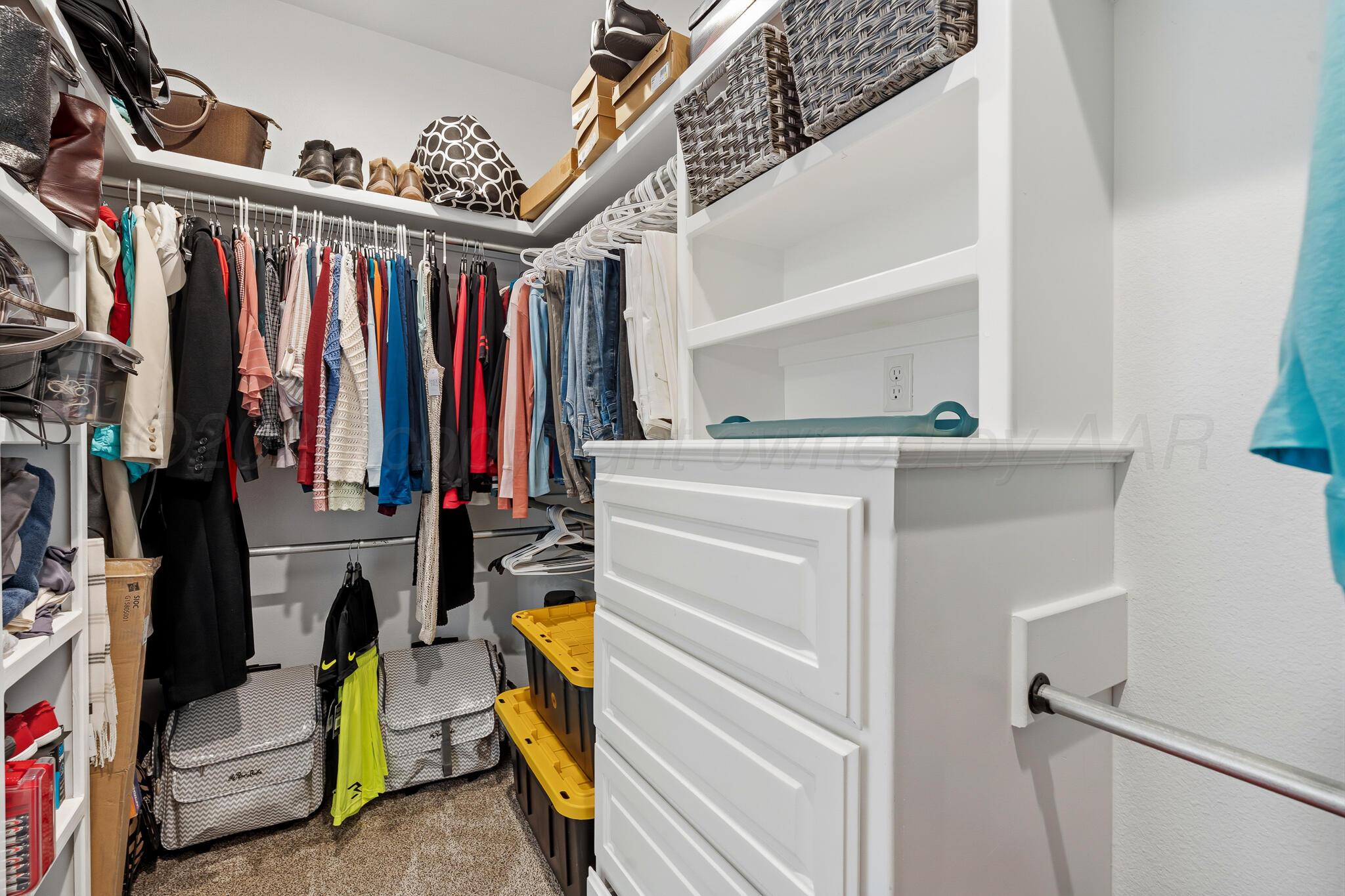 9801 Yesterday Amarillo, TX 79119 - Photo 39 of 54 a view of walk in closet with clothes and shoes