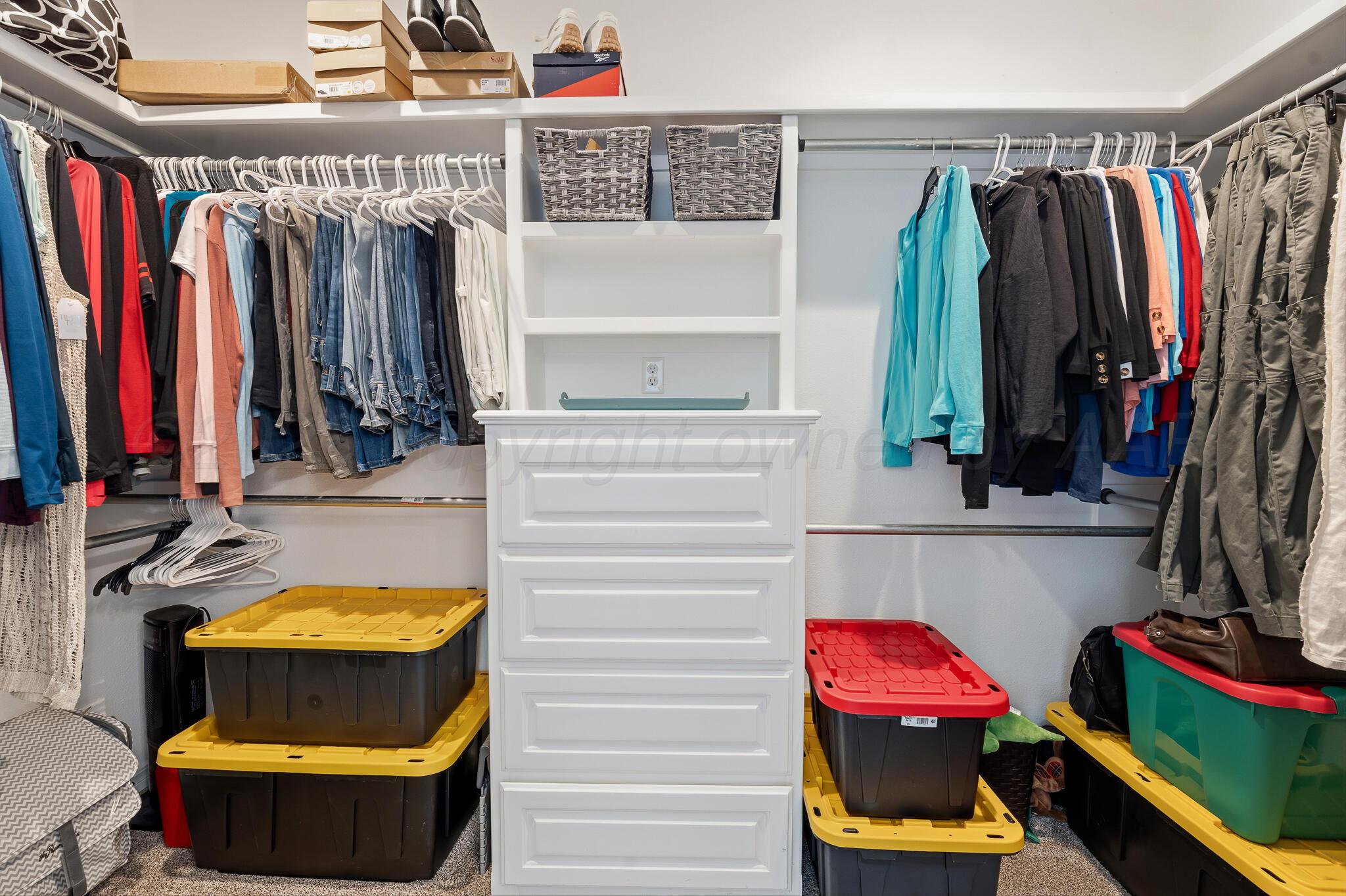 9801 Yesterday Amarillo, TX 79119 - Photo 40 of 54 a view of walk in closet with clothes and shoes