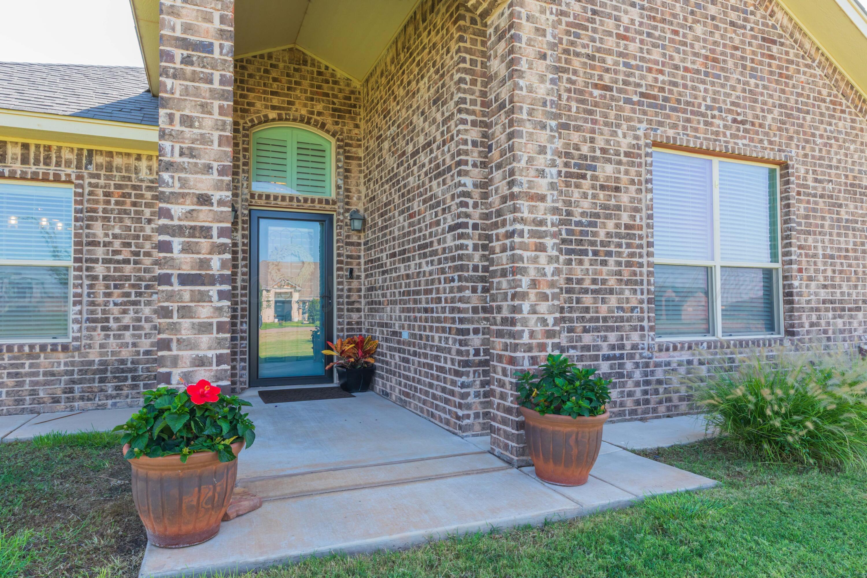 9801 Yesterday Amarillo, TX 79119 - Photo 4 of 54 a view of a house with a potted plant