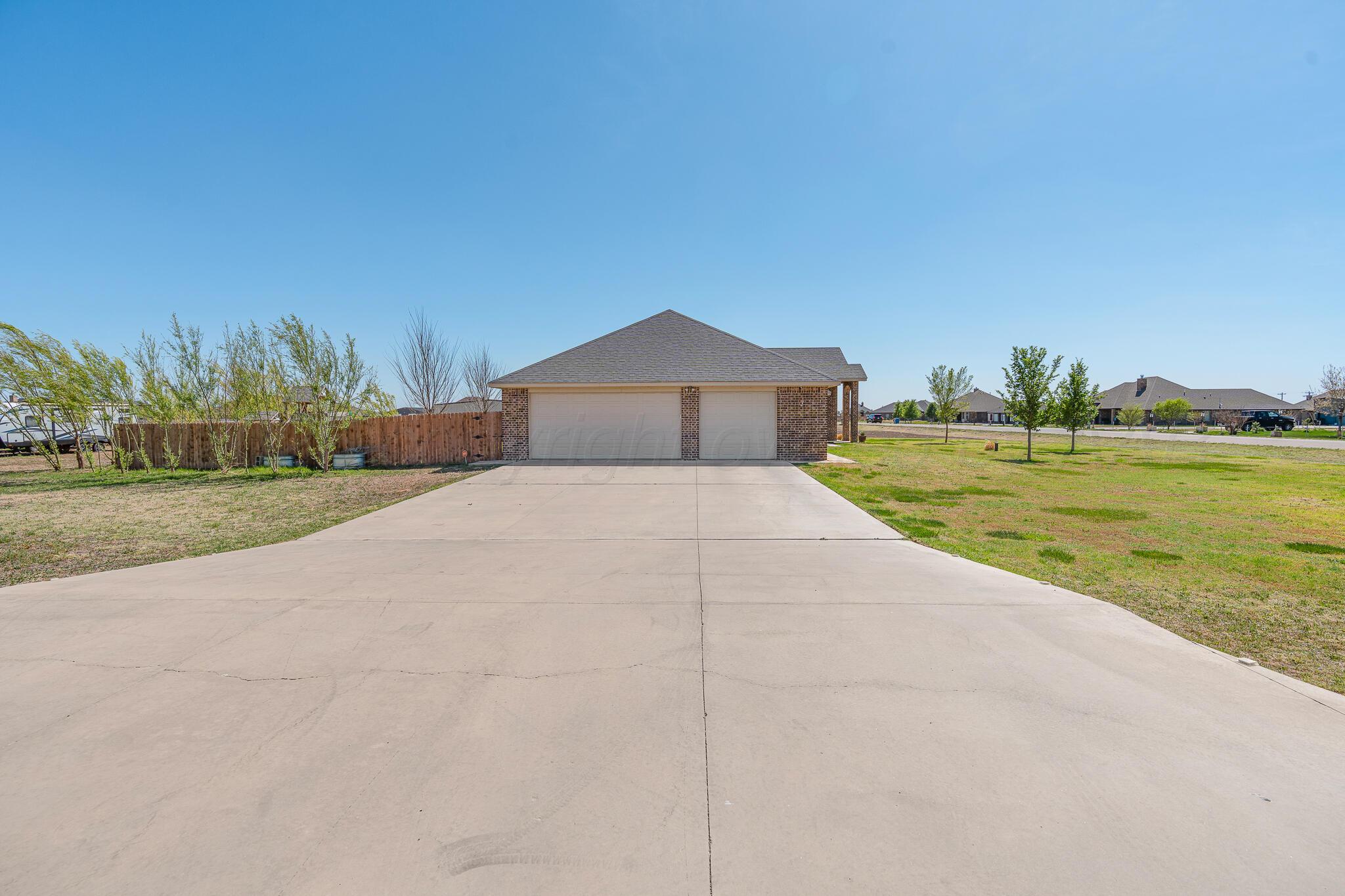 9801 Yesterday Amarillo, TX 79119 - Photo 45 of 54 a view of a big yard next to a yard