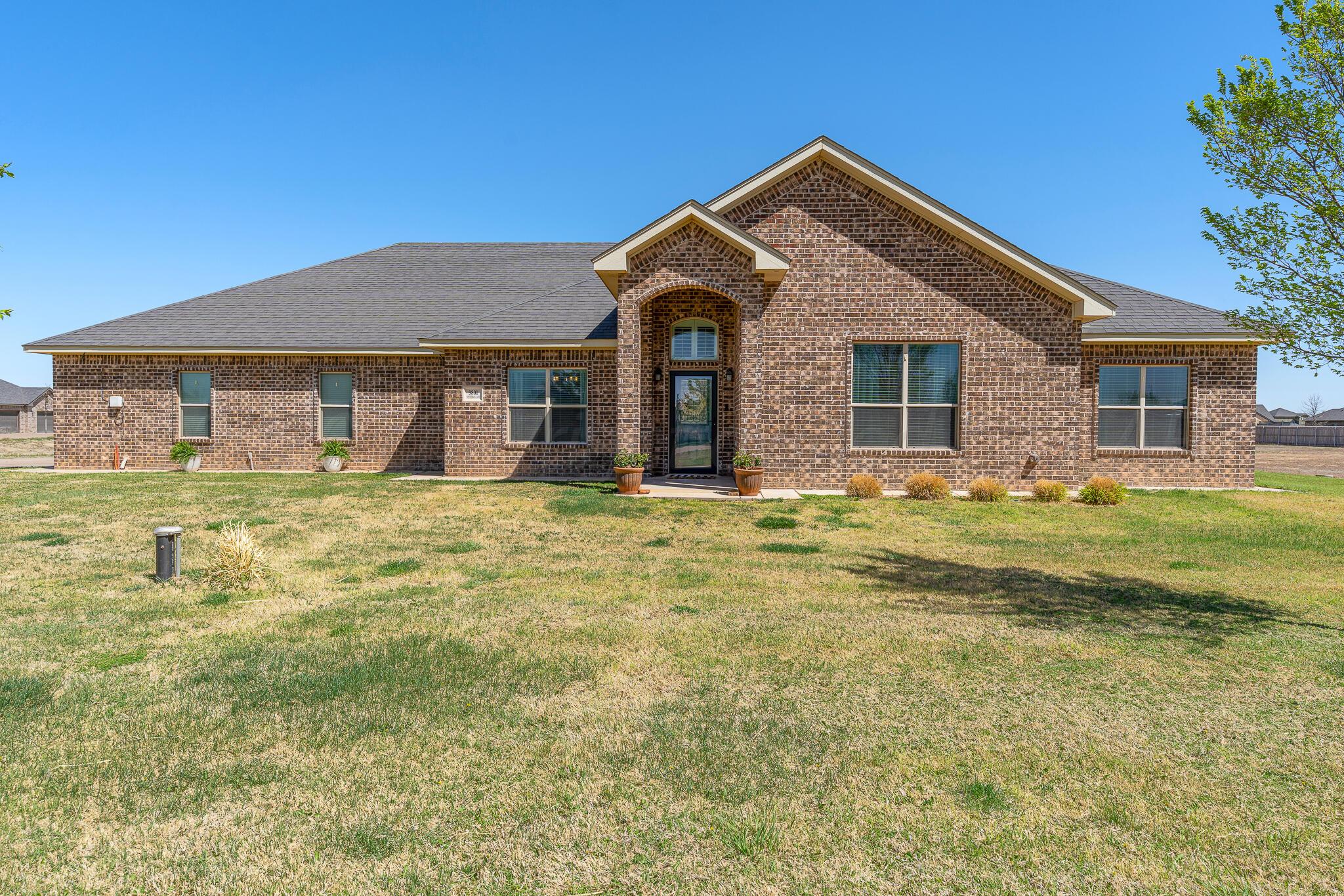 9801 Yesterday Amarillo, TX 79119 - Photo 46 of 54 a front view of house with yard and green space