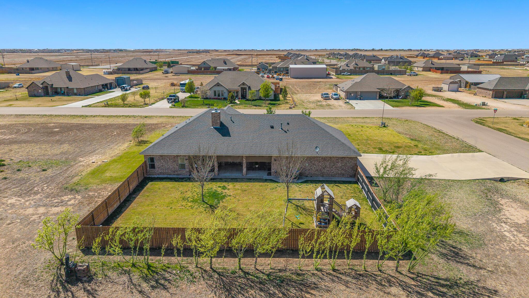 9801 Yesterday Amarillo, TX 79119 - Photo 48 of 54 an aerial view of residential houses with outdoor space