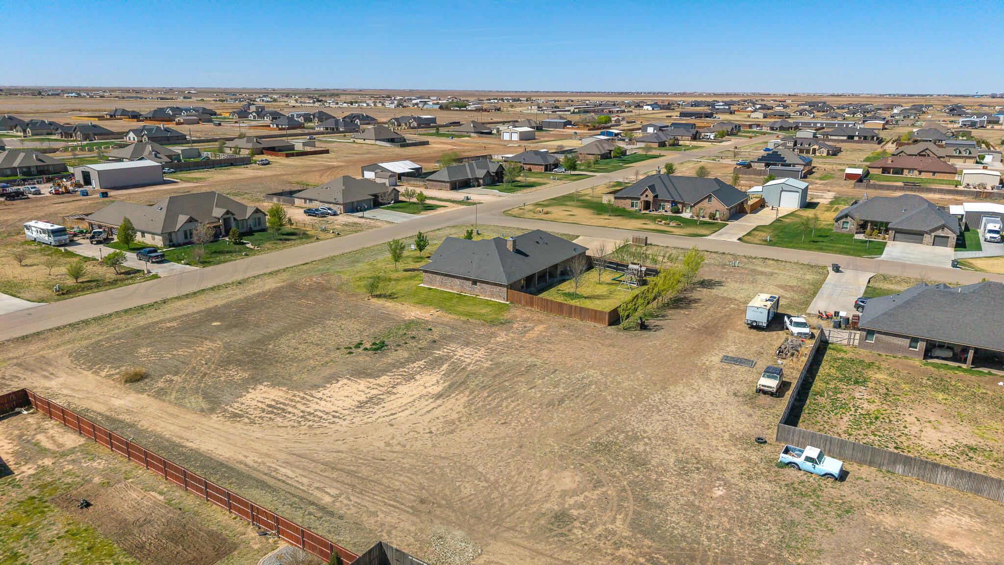 9801 Yesterday Amarillo, TX 79119 - Photo 53 of 54 an aerial view of residential houses with outdoor space