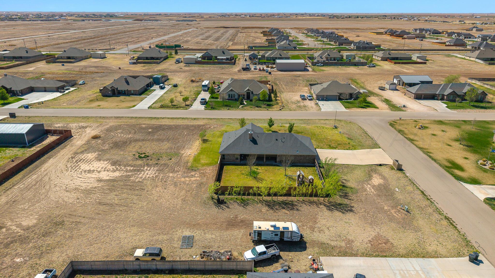 9801 Yesterday Amarillo, TX 79119 - Photo 54 of 54 an aerial view of residential houses with outdoor space
