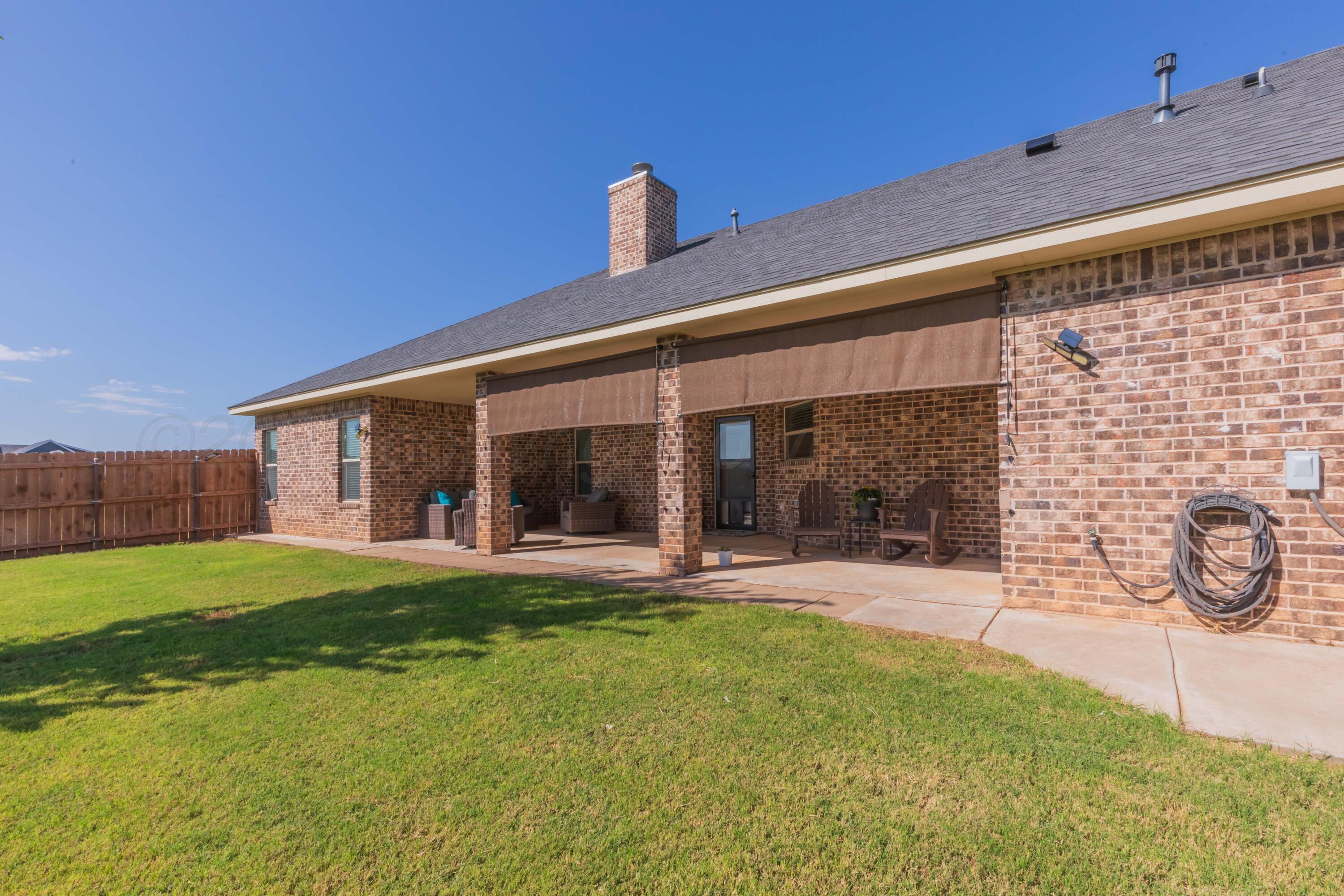 9801 Yesterday Amarillo, TX 79119 - Photo 9 of 54 a view of a house with a yard and sitting area