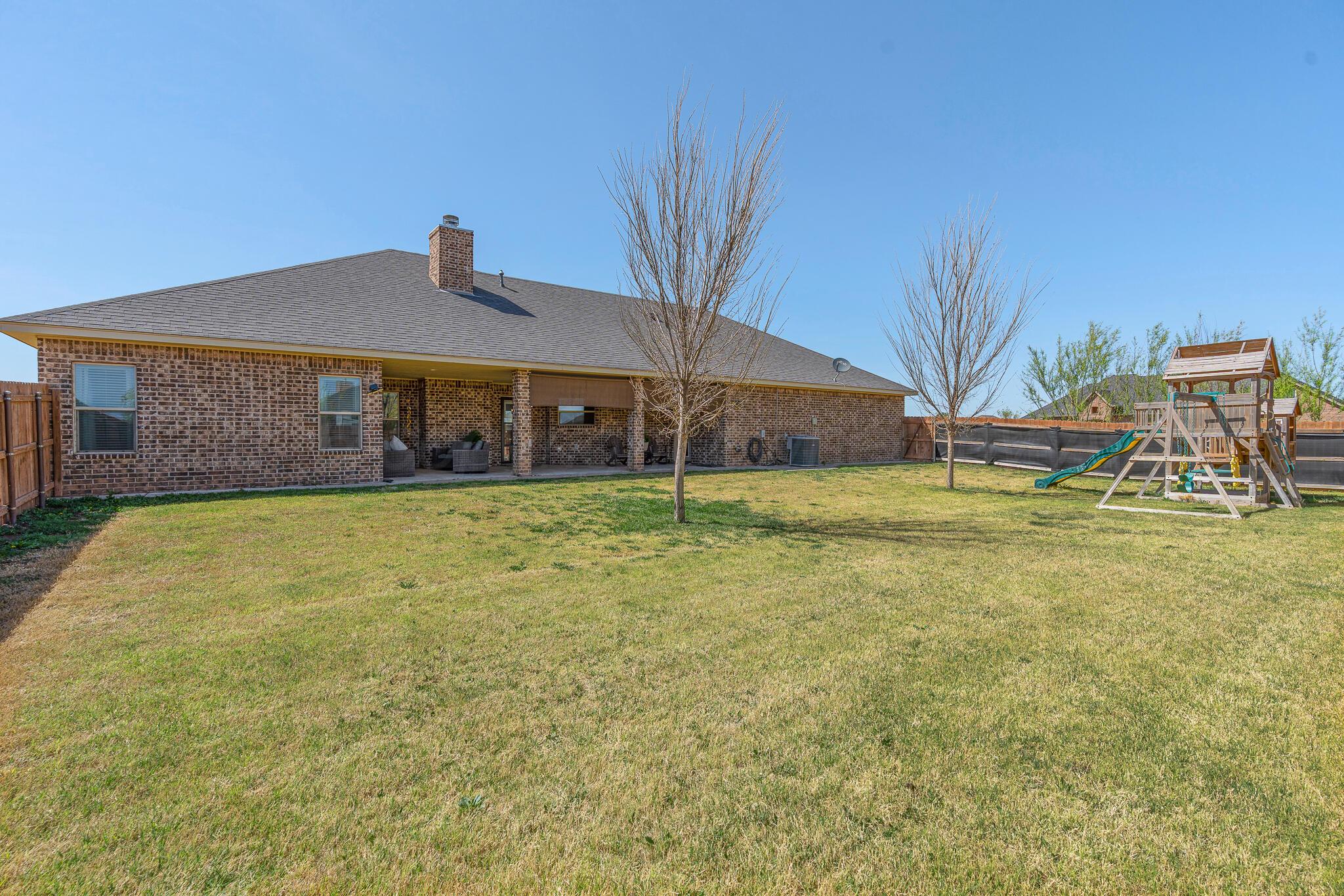 9801 Yesterday Amarillo, TX 79119 - Photo 10 of 54 a view of a house with a yard
