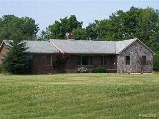 8260 West Coon Lake Road Gregory, MI 48137 - Photo 1 of 1 FRONT OF STONE/BRICK HOME ON 10