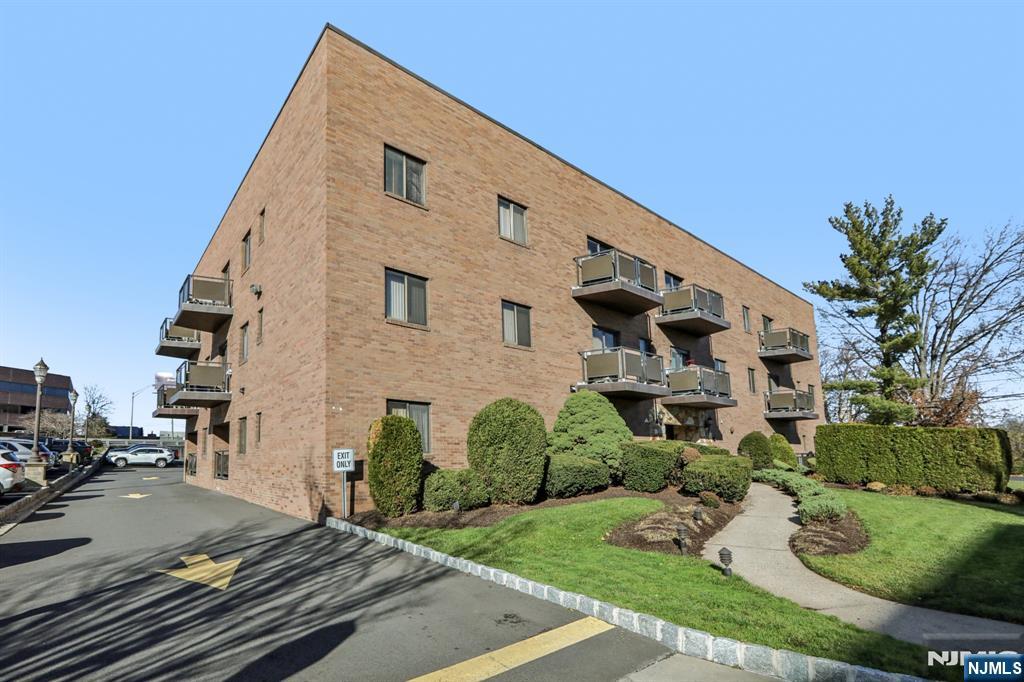 279 Clark Street, Unit A7 Hackensack, NJ 07601 - Photo 1 of 34 a front view of a house with garden