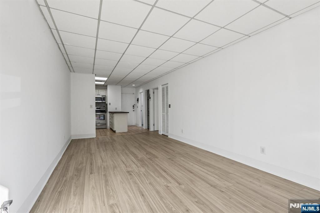 279 Clark Street, Unit A7 Hackensack, NJ 07601 - Photo 11 of 34 a view of empty room with wooden floor