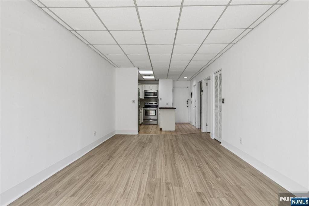 279 Clark Street, Unit A7 Hackensack, NJ 07601 - Photo 12 of 34 a view of a livingroom with wooden floor