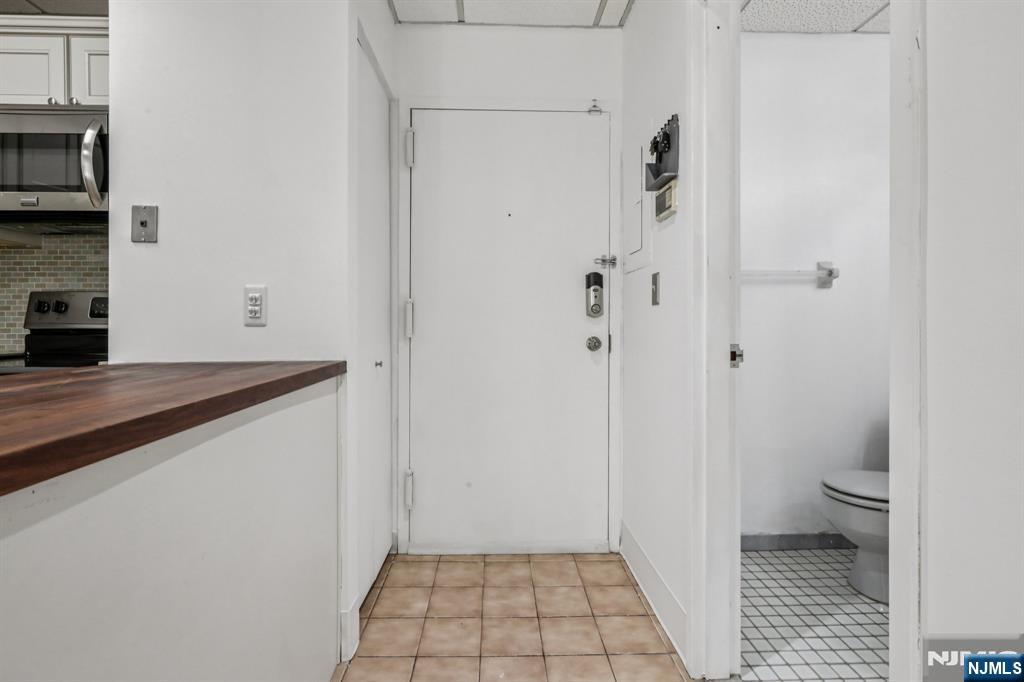 279 Clark Street, Unit A7 Hackensack, NJ 07601 - Photo 19 of 34 a bathroom with a sink and a toilet